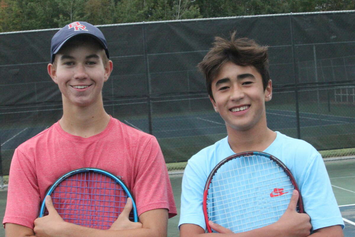 The Big Rapids No. 1 doubles team of Austin Hinkley (left) and Carson Coles and their Cardinal teammates are going to the state finals.