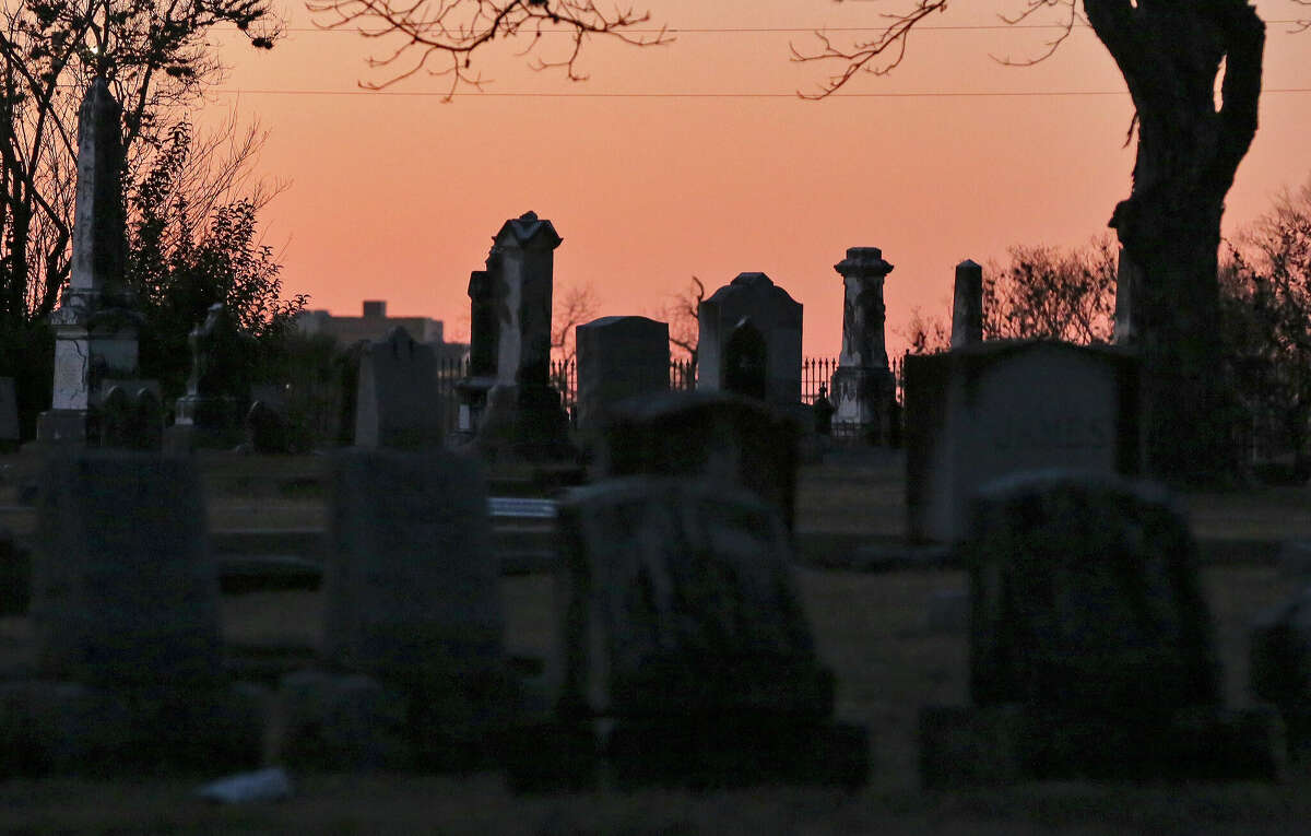 The sun sets at City Cemetery #1 as Stephen and Fred Garza-Guzman of Curious Twins Paranormal and Ghost Tours host public tours of San Antonio graveyards, designed to educate people about the city's history and also involve some ghost hunting at the site.