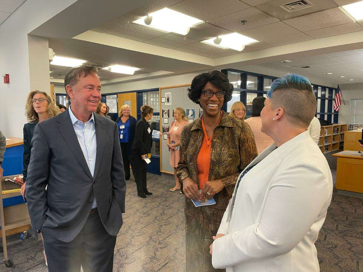 Carolyn Kielma, right, a science teacher in Bristol, with Connecticut Gov. Ned Lamont and Education Commissioner Charlene Russell-Tucker, center. Kielma has been named a finalist for the National Teacher of the Year award. She was previously named Connecticut Teacher of the Year.