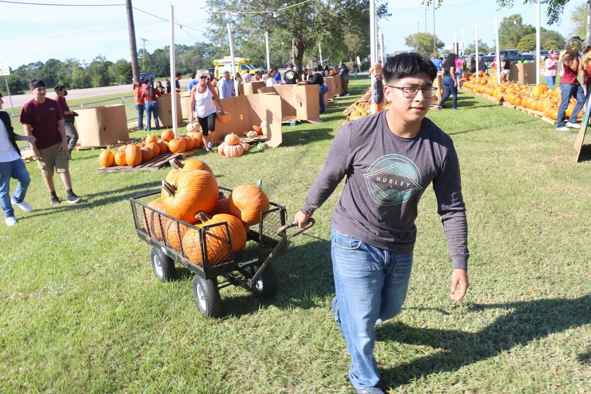 Daniel Hernandez hauls a crate of pumpkins on Thursday, Oct. 6, 2022, at Wesley United Methodist Church in Beaumont.