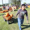 Daniel Hernandez hauls a crate of pumpkins on Thursday, Oct. 6, 2022, at Wesley United Methodist Church in Beaumont.