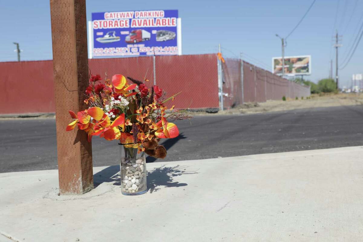 A memorial of flowers sits in front of Gateway Parking, the business where 4 members of the Singh family were abducted from and killed this week, in Merced, Calif., on Thursday, October 6, 2022.