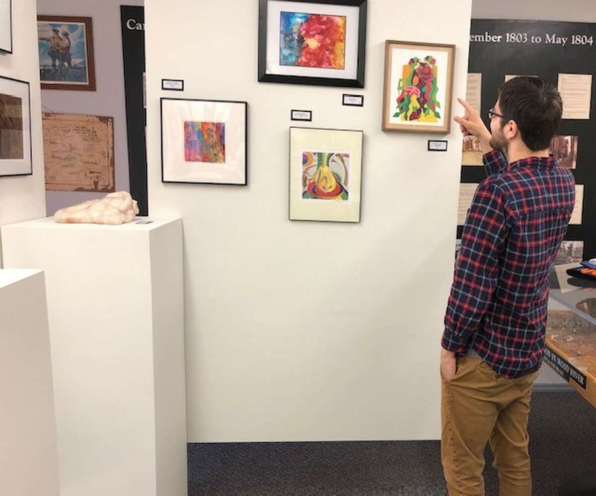 A visitor enjoys the view at the last Wood River Heritage Council's Small Works Art  Show. This year's ninth annual juried Small Works Art  Show opens Friday, Oct. 14, at the Wood River Museum and Visitors Center, 40 W. Ferguson Ave., in Wood River.