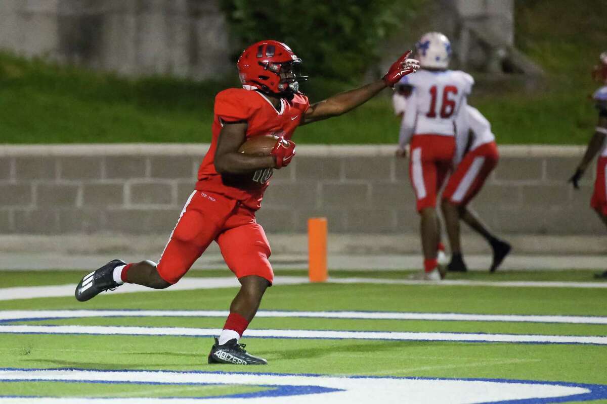 HOUSTON, TX OCT 6: Waltrip Rams Drake Williams (10) scores a touchdown in the third quarter during the District 11-4A Division I high school football game between the Madison Dolphins and Waltrip Rams at Delmar Stadium in Houston, Texas.