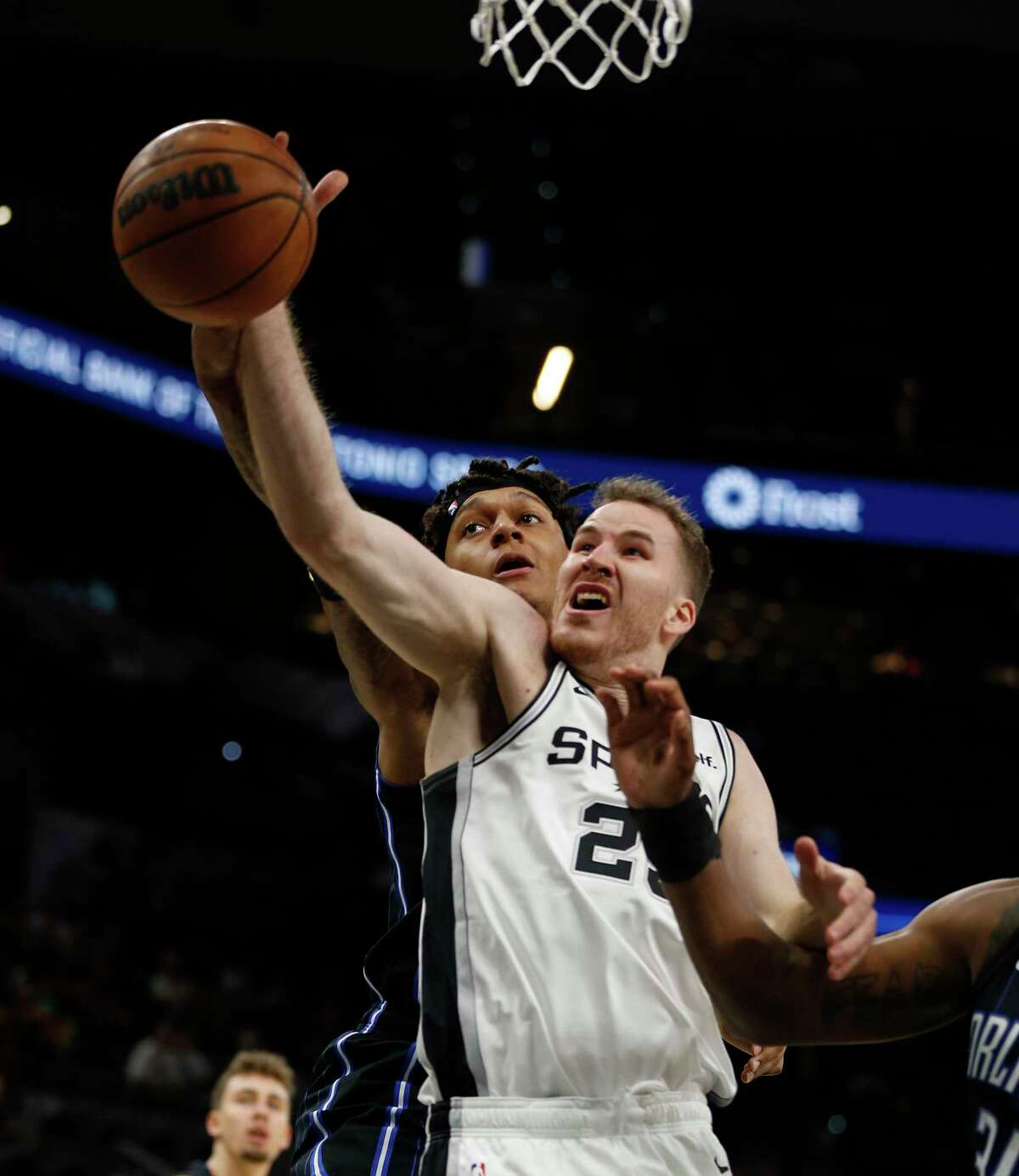 San Antonio Spurs Jakob Poeltl (25) battles for a rebound against Magic in a Preseason Game on Thursday, Oct. 6, 2022 at the AT&T Center.