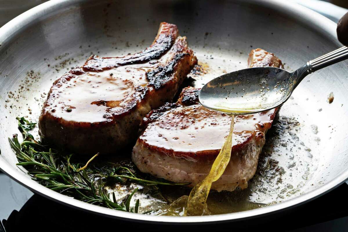 Use a large spoon to baste the chops with the butter, until the meat has an internal temperature of about 135 degrees.