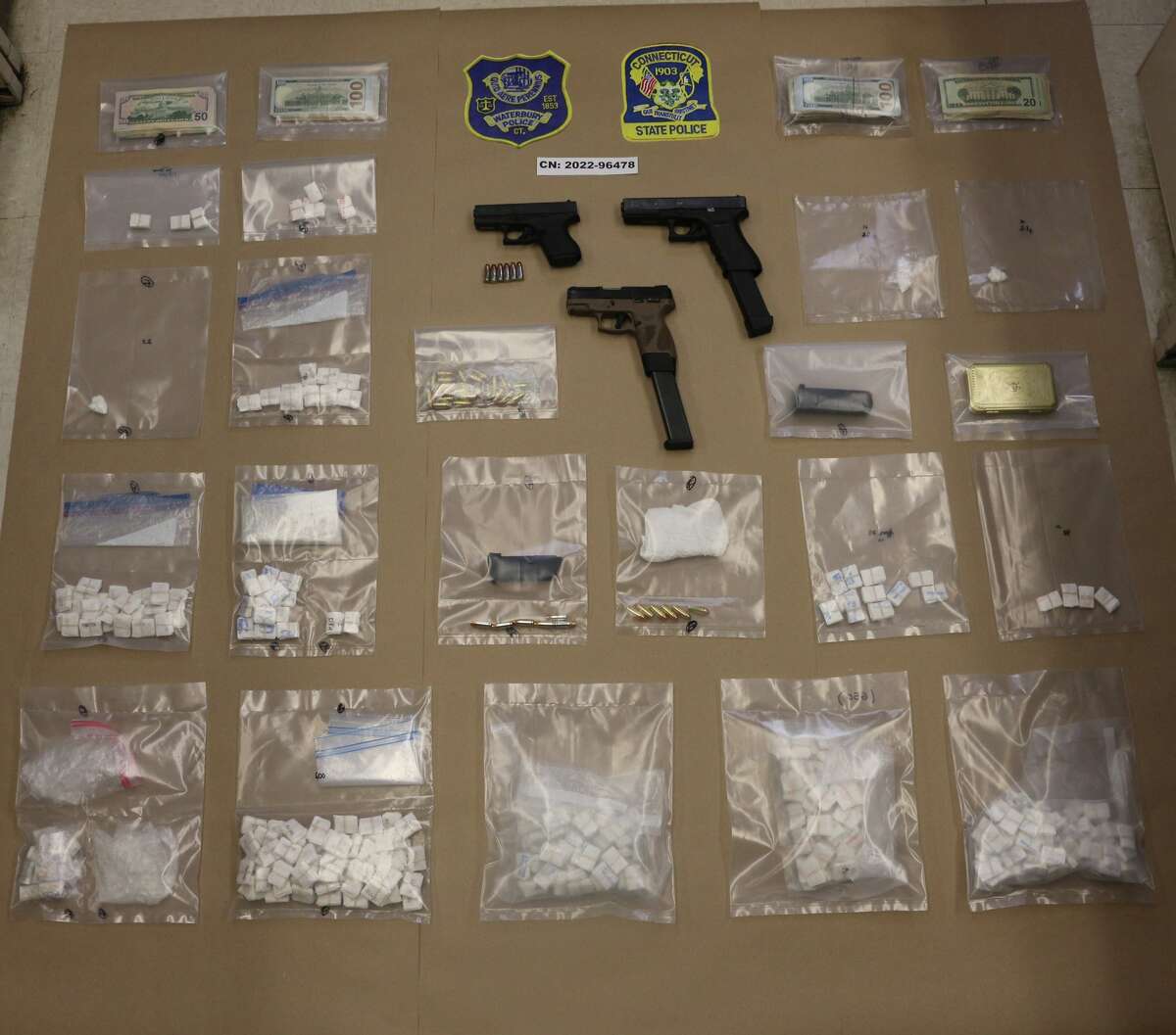 Waterbury police arrested five residents after they allegedly found heroin, crack cocaine and guns in two homes on Aetna Street and Fieldwood Road Wednesday. 
