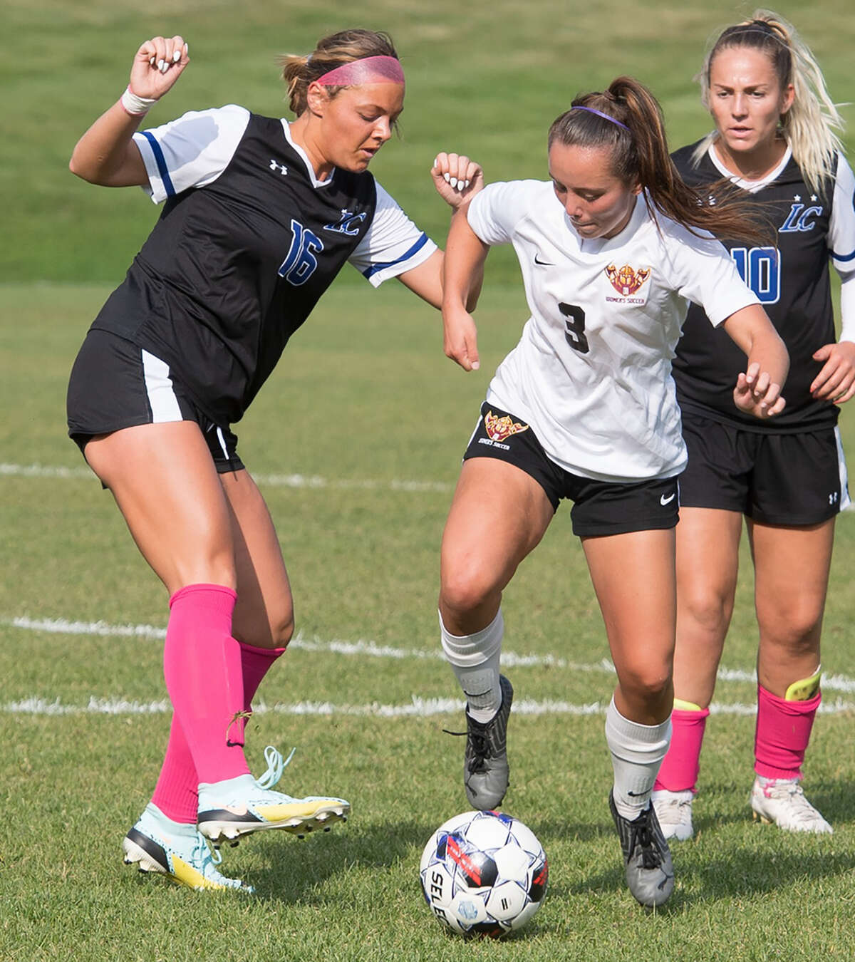 Shay Polson of Indian Hills (3) battles for the ball with LCCC's Maycee Gall (16) Thursday in Ottumwa, iowa. Also pictured is LCCC's Laura Douet (10).
