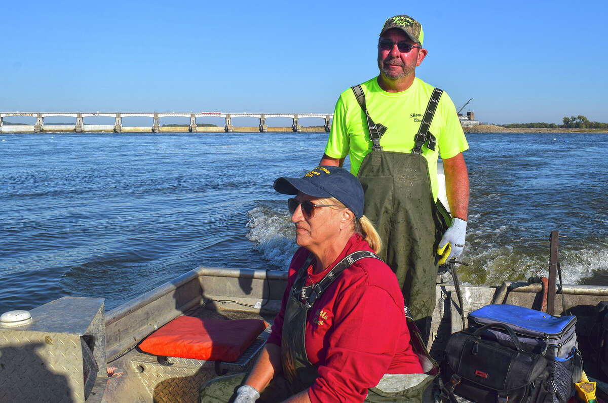 Cliff and Cara Rost of Pleasant Hill get on the Mississippi River every day between Oct. 1 and May 31, checking their nets for hackleback sturgeon from which they make Show-Me Caviar. They work together and are the only employees of the company.