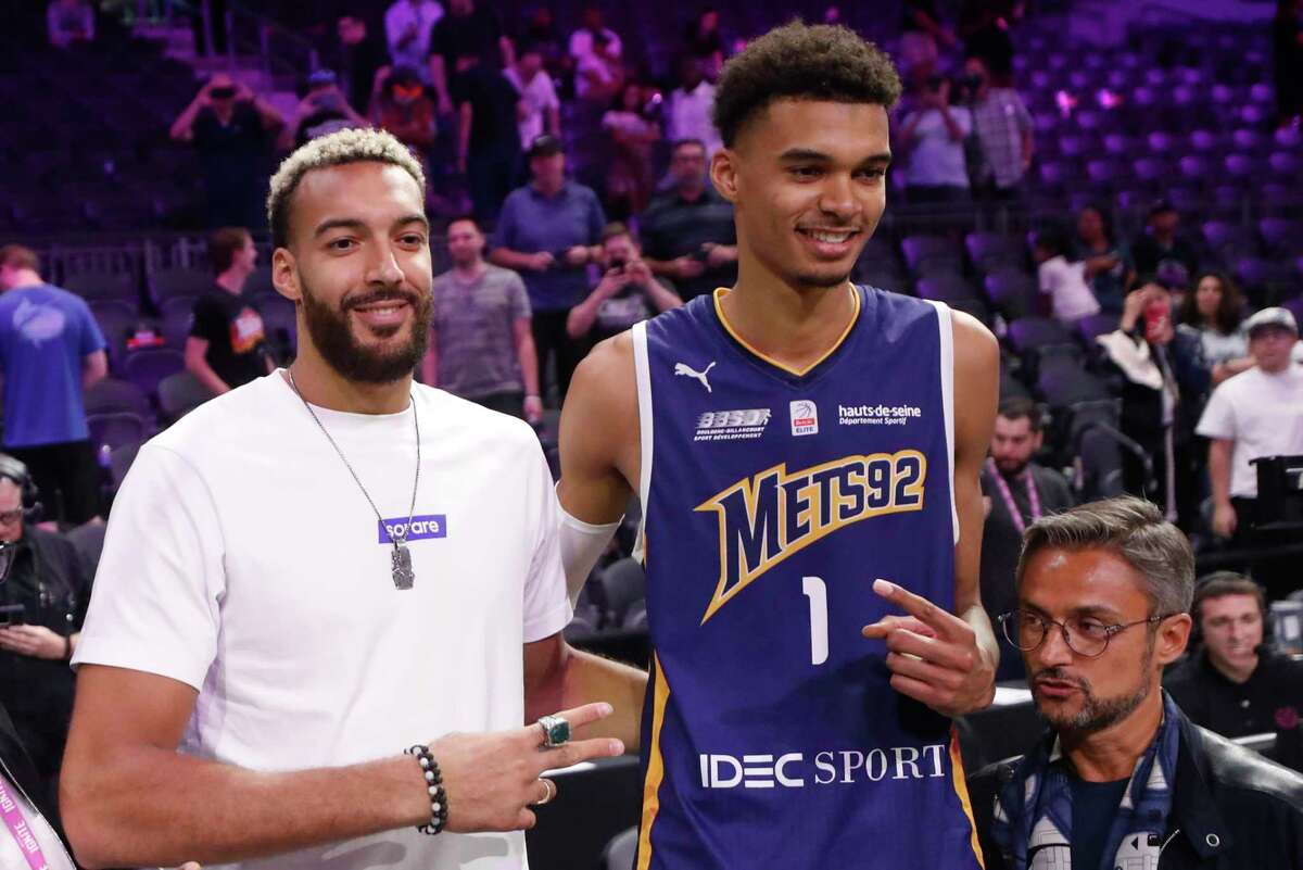 HENDERSON, NEVADA - OCTOBER 06: Rudy Gobert, (L) a French NBA player for the Minnesota Timberwolves, poses next to Victor Wembanyama #1 of Boulogne-Levallois Metropolitans 92 after an exhibition game against G League Ignite at The Dollar Loan Center on October 06, 2022 in Henderson, Nevada. NOTE TO USER: User expressly acknowledges and agrees that, by downloading and or using this photograph, User is consenting to the terms and conditions of the Getty Images License Agreement. (Photo by Steve Marcus/Getty Images)