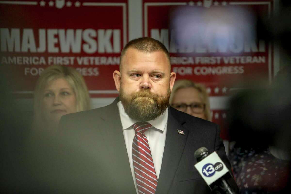 J.R. Majewski defends his military record at a news conference in September. Why isn’t the term veteran good enough?