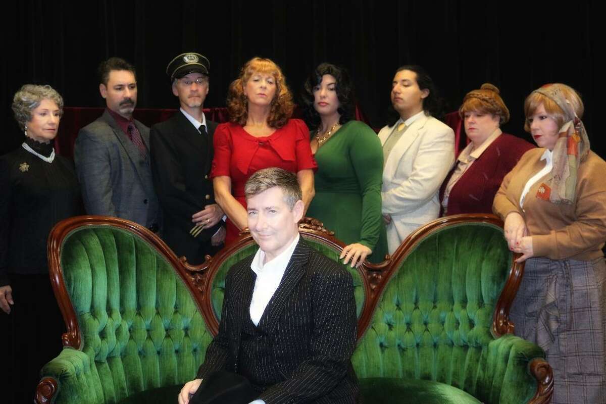 Surrounded by an array of actors portraying possible suspects, James Taylor, front, plays murder victim Samuel Ratchett in Pasadena Little Theatre's production of "Murder on the Orient Express." Also performing in the show are Barbara Winburn, left, Bill Anders, Chris Lowe, Bonnie Reichel, Stephanie Patrisso, Ish Martinez, Kristina Treybig and Heather Green.