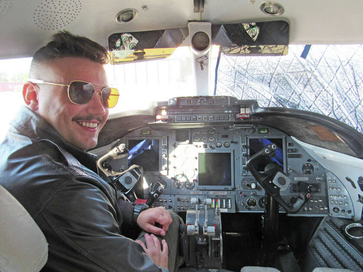 1st Lt. Nick Felton sits in the cockpit of a C-21 aircraft at Scott Air Force Base.