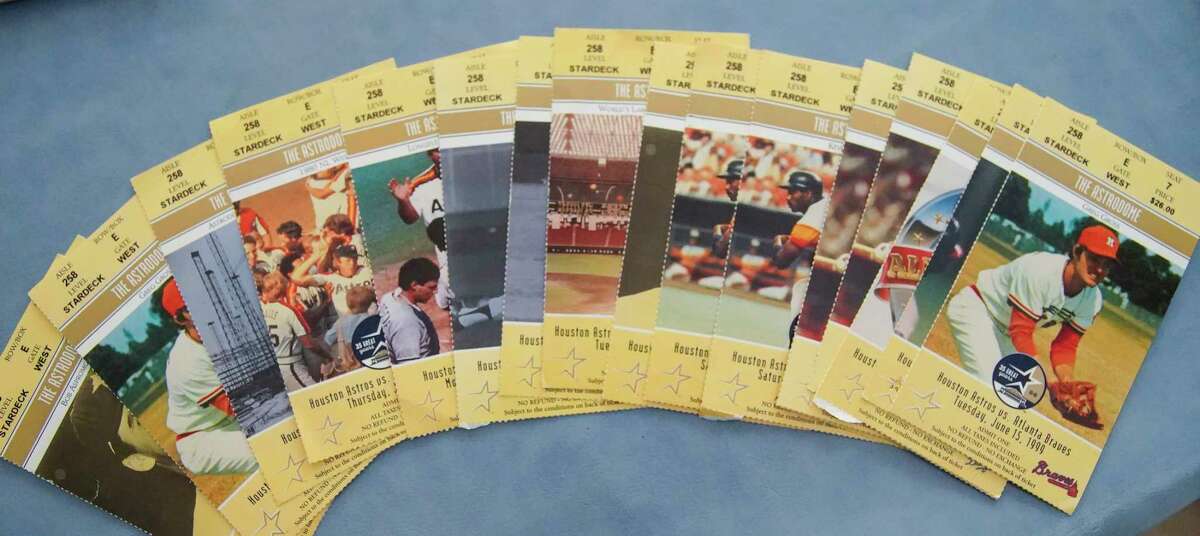 A set of commemorative season tickets from 1999, the final year baseball was played in the Astrodome, are among Sherri Israel Taxman’s Houston Astros memorabilia at her home on Friday, Oct. 7, 2022 in Houston. Taxman’s father, Harold Israel, was the Astros long-time photographer.