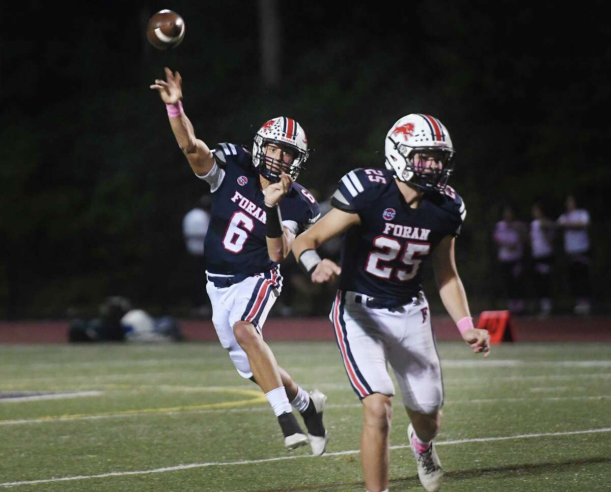 Foran quarterback Jack Cushman delivers a pass during the first half of their football game with East Haven at Foran High School in Milford, Conn. on Friday, October 7, 2022.