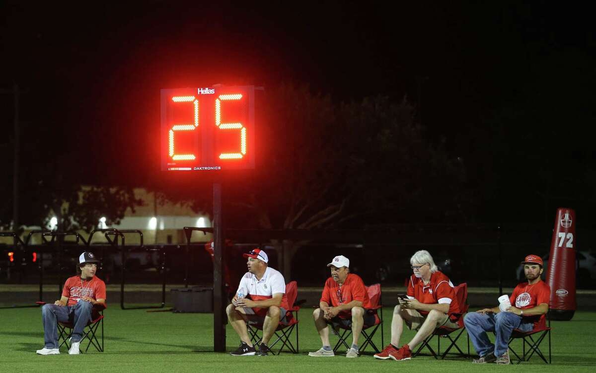 Bellville staff and fans watch the game against Brookshire from behind the end zone during the third quarter of a District 11-4A Division II game Friday, Oct. 7, 2022, at Brahma Stadium in Bellville.