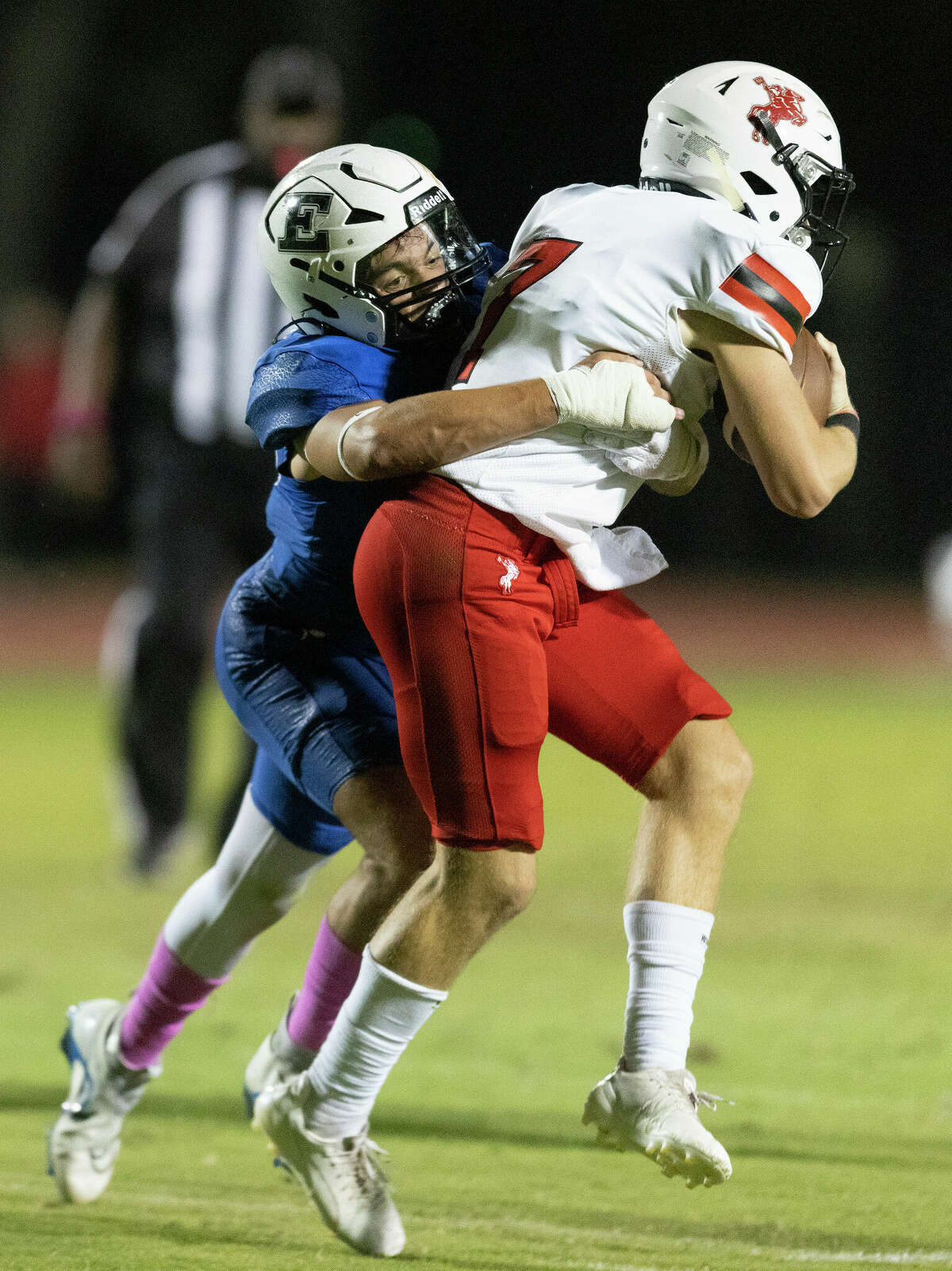 Saint Johns Mavericks Stephen Gill (7) is sacked by Episcopal Knights middle linebacker Brady Reed (45) for a loss of yards in the first half of a SPC 4A football game at Simmons Field in Bellaire, TX.