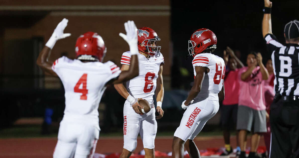 North Shore quarterback David Amador (8) celebrates a touchdown in the first half of the District 21-6A high school football game between the North Shore Mustangs and the Summer Creek Bulldogs at Turner Stadium in Humble, TX on Friday, October 7, 2022.