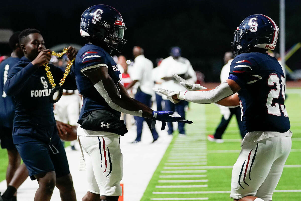 Cypress Springs running back Tim Saunders, right, celebrates his touchdown with Ashton Blake during the first half of a high school football game against Cypress Lakes, Friday, Oct. 7, 2022, in Cypress.
