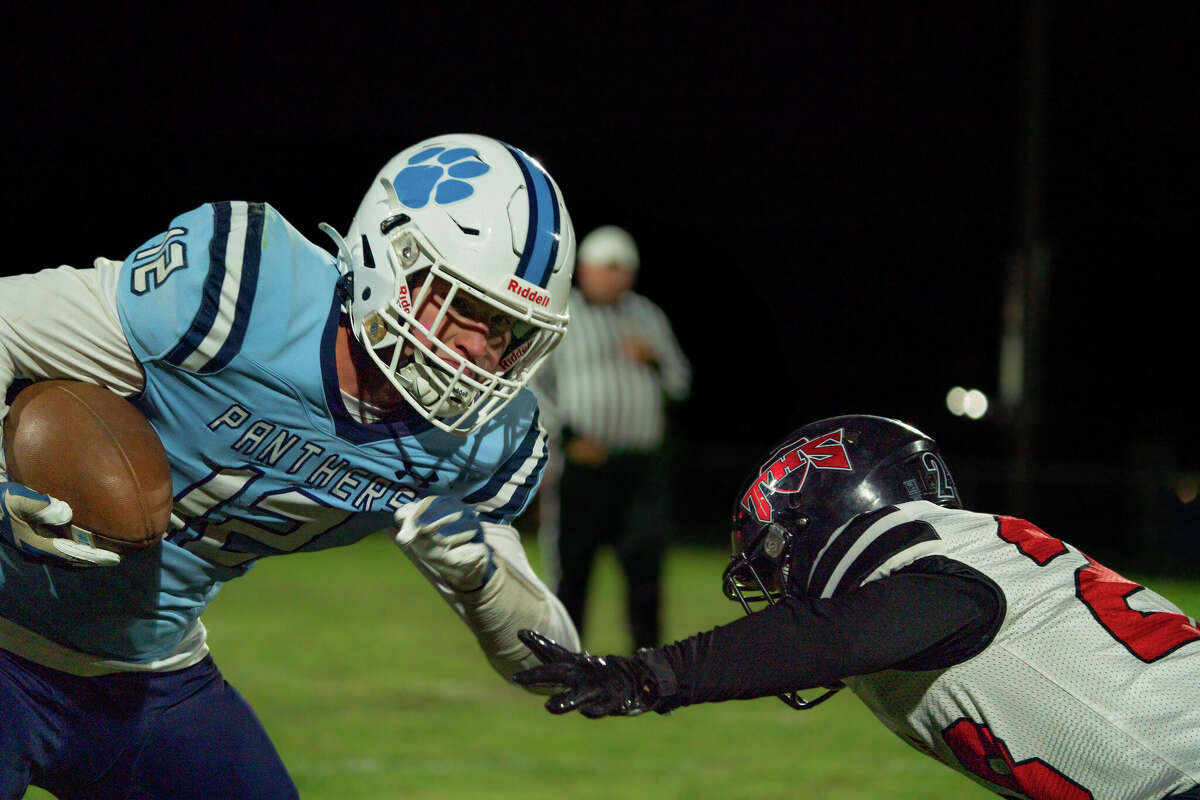 Jersey tight end Tanner Brunaugh (12) shakes Triad's Dane Gallo (28) after a catch and run Friday night.