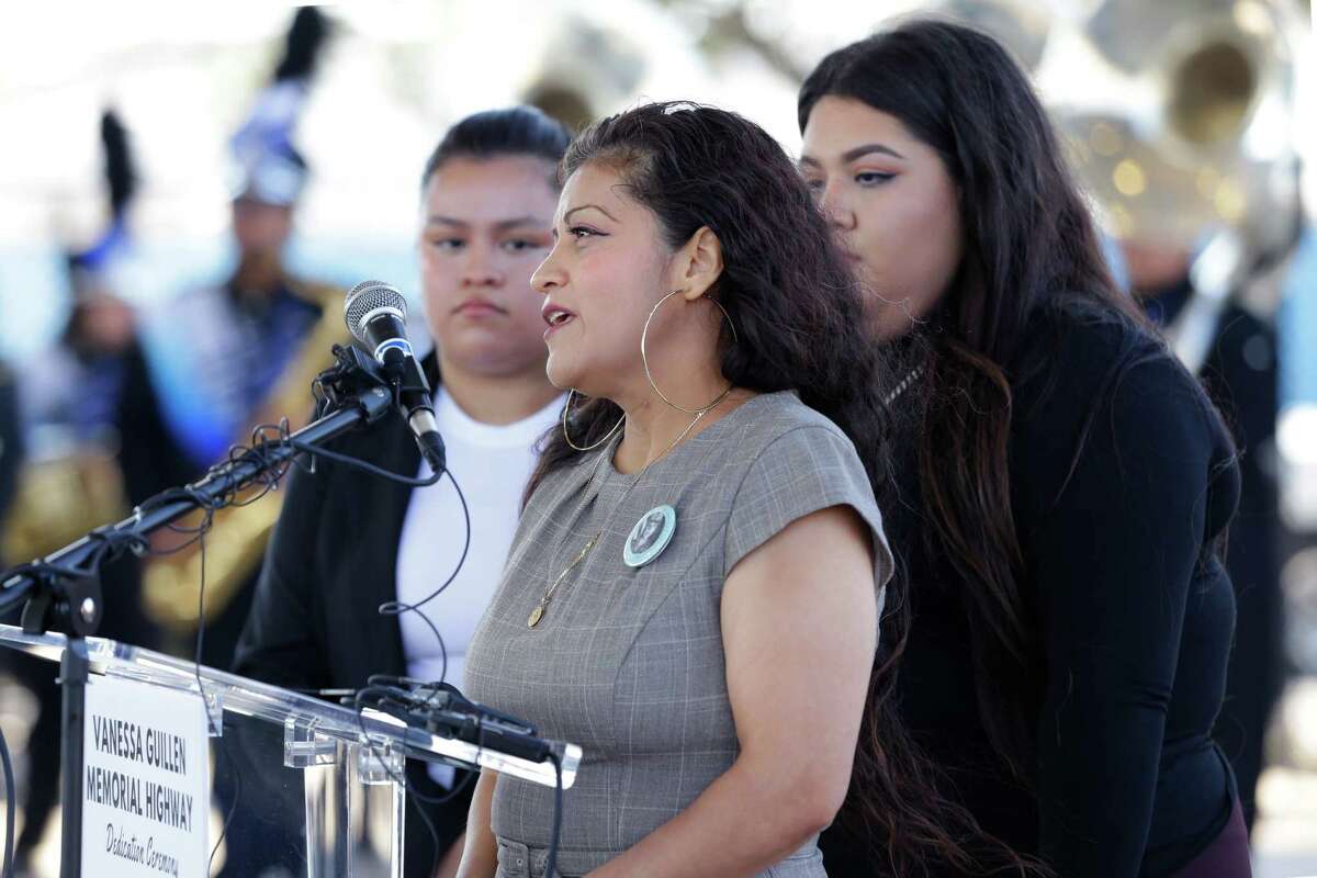 Gullien family members, from left, sister Lupe, mother Gloria, and another sister Myra speak during a ceremony held at the KIPP school grounds unveiling a new highway sign memorializing Vanessa Gulling Saturday, Oct. 8, 2022 in Houston, TX.