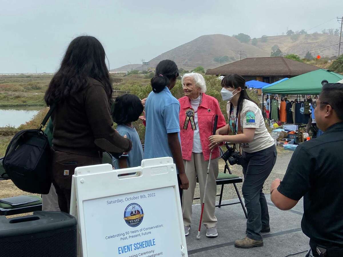 Activist Florence LaRiviere, 98, speaks with children at the 50th anniversary celebration for the Don Edwards San Francisco Bay National Wildlife Refuge. LaRiviere played an integral role in getting support to protect the land in 1972.
