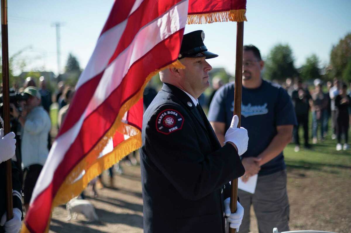 The Santa Rosa Fire Department honor guard presents the U.S. and California flags on the fifth anniversary of the Tubbs Fire.