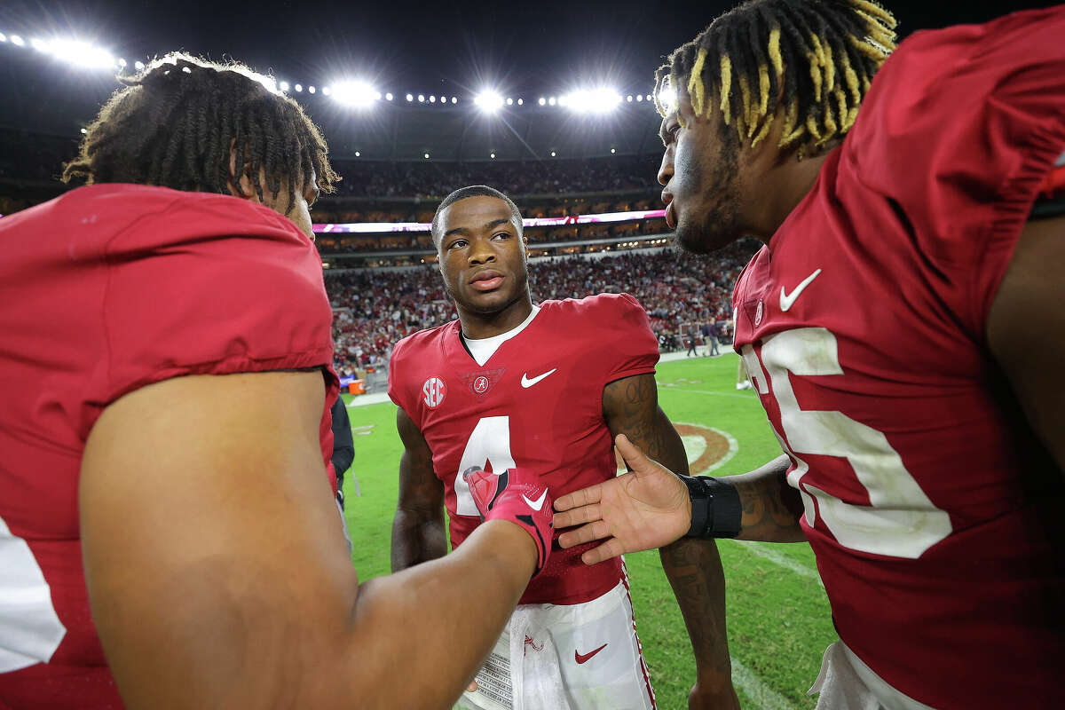 TUSCALOOSA, ALABAMA - OCTOBER 08: Jalen Milroe #4 of the Alabama Crimson Tide reacts after their 24-20 win over the Texas A&M Aggies with Amari Kight #78 and JC Latham #65 at Bryant-Denny Stadium on October 08, 2022 in Tuscaloosa, Alabama. (Photo by Kevin C. Cox/Getty Images)