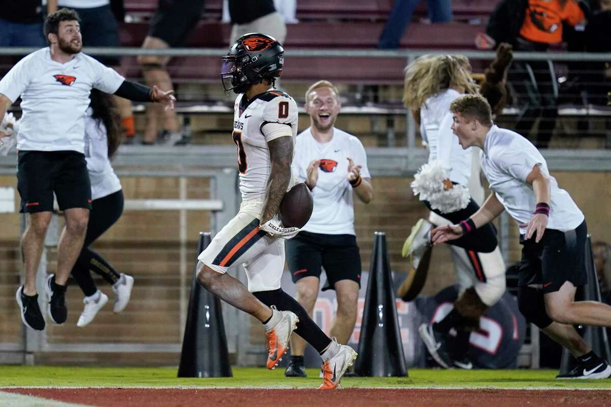 Oregon State wide receiver Tre'Shaun Harrison (0) scores a 56-yard receiving touchdown against Stanford during the second half of an NCAA college football game in Stanford, Calif., Saturday, Oct. 8, 2022. Oregon State won 28-27. (AP Photo/Godofredo A. Vásquez)