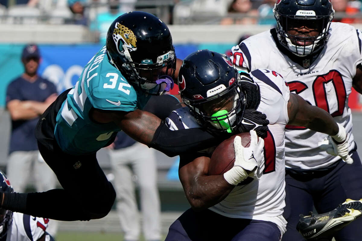 Dameon Pierce, being tackled by Jacksonville's Tyson Campbell, was the force of the Texans offense on Sunday.