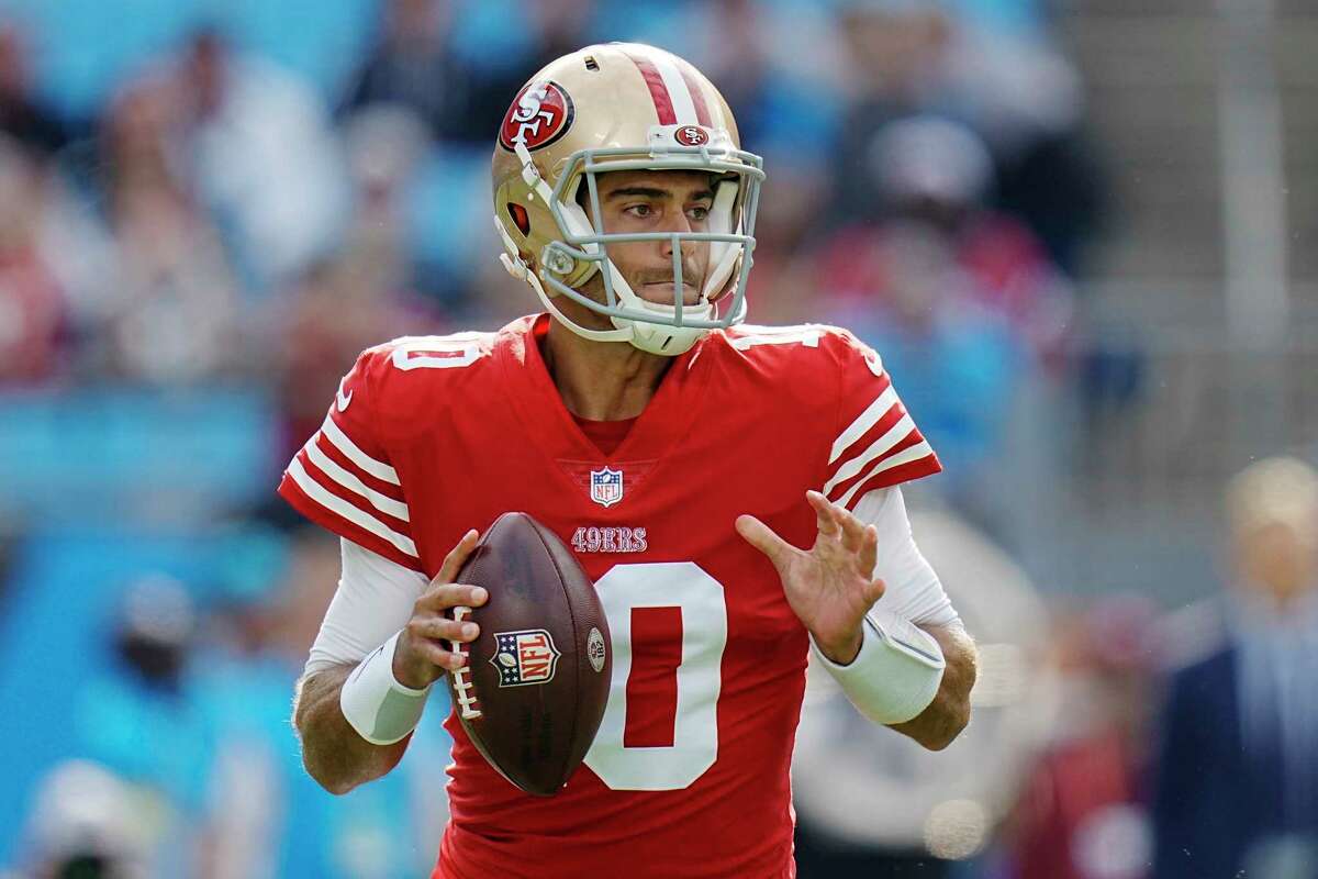 San Francisco 49ers quarterback Jimmy Garoppolo looks to pass during the first half an NFL football game against the San Francisco 49ers on Sunday, Oct. 9, 2022, in Charlotte, N.C. (AP Photo/Rusty Jones)