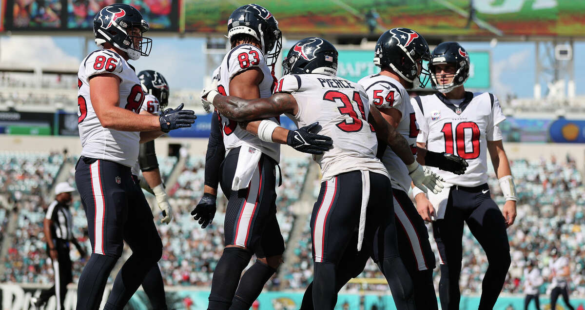 Dameon Pierce #31 of the Houston Texans celebrates with teammates after running the ball for a touchdown during the second half against the Jacksonville Jaguars at TIAA Bank Field on October 09, 2022 in Jacksonville, Florida. (Photo by Mike Carlson/Getty Images)