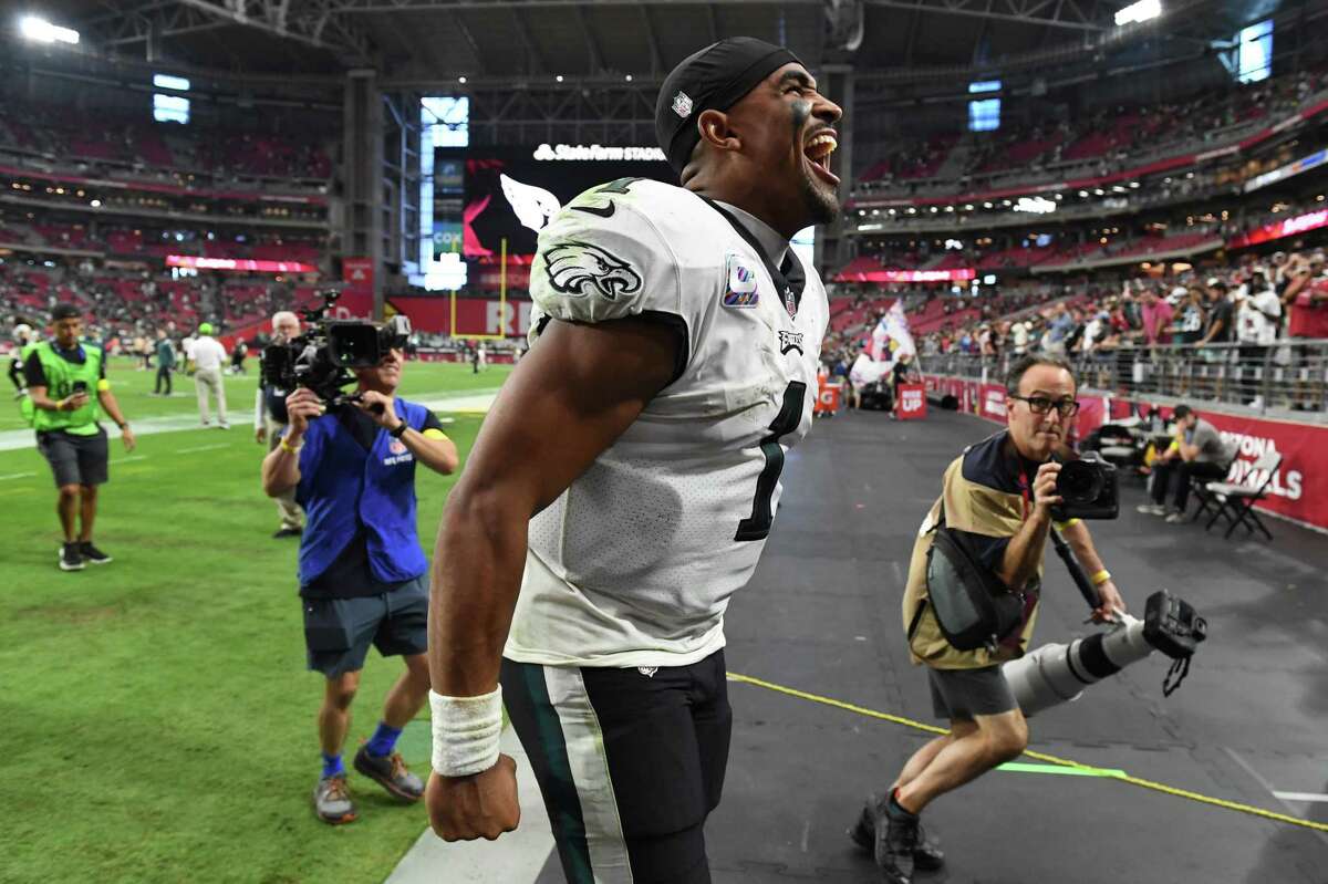 Eagles quarterback Jalen Hurts ran for two touchdowns and threw for 239 yards as Philadelphia stayed unbeaten with a win against the Cardinals.