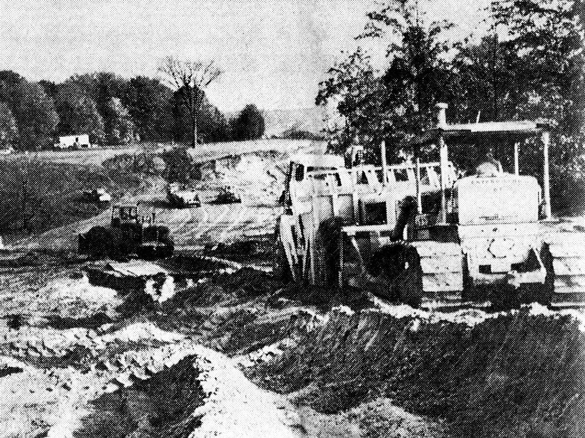 Bulldozers, earth movers and graders are all busy doing their part on the relocation of U.S. 31 near Norwalk. The large curve south of Norwalk will be eliminated with the $8,500 foot cut which includes a bridge over the railroad. The photo was published in the News Advocate on Oct. 11, 1962.