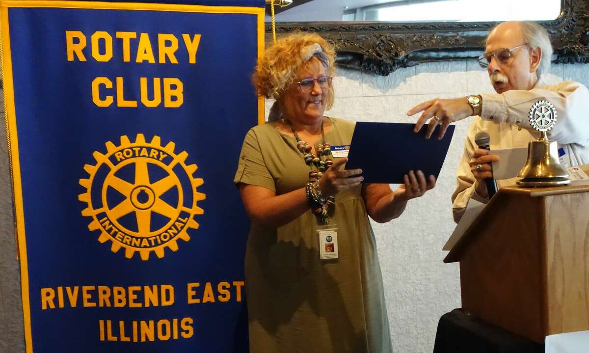 Tammy Iskarous, Executive Director of Riverbend Family Ministries, was recently is presented with her Rotary Paul Harris Fellowship award by Leonard Berg at a recent Riverbend East Rotary Club meeting.