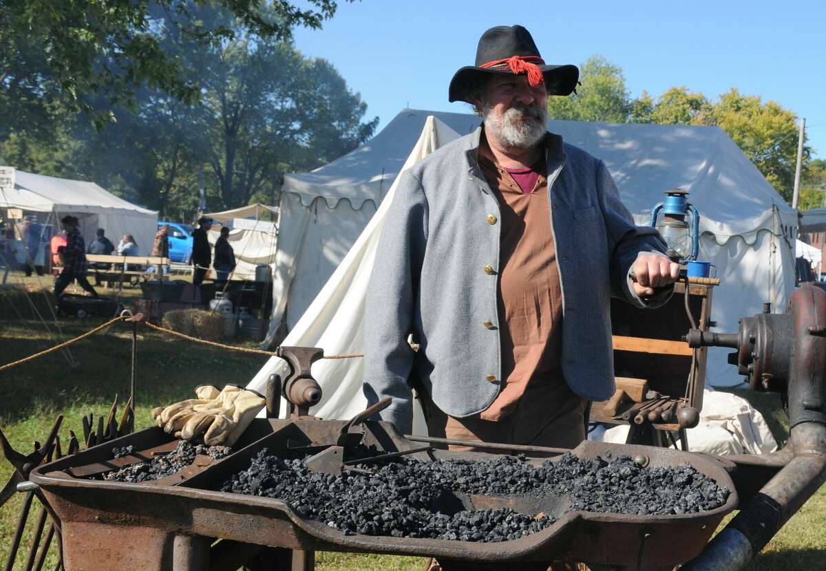 Chris Beilsmith of Brighton does some blacksmithing during Kampsville Old Settlers Days. The annual event recalls Illinois River history more than two centuries ago.