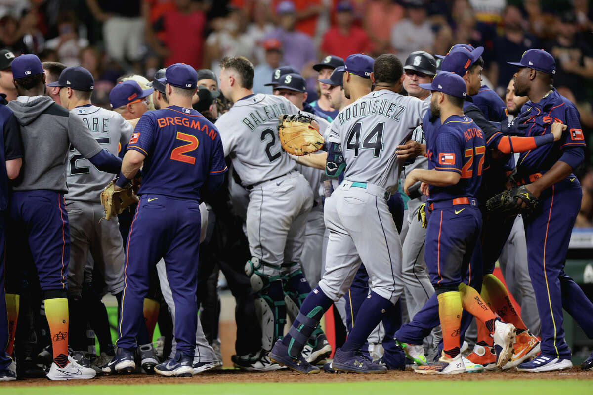 Houston Astros and Seattle Mariners benches clear after Ty France of the Seattle Mariners was hit by a pitch during the ninth inning at Minute Maid Park on June 6, 2022.