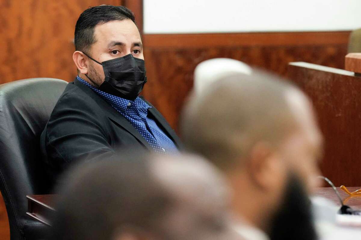 Baytown Police officer Juan Delacruz sits in the courtroom listening to closing arguments in the trial against him Monday, Oct. 10, 2022 in Houston. Delacruz is charged with aggravated assault by a public servant, in connection with the May 2019 shooting death of Pamela Turner.