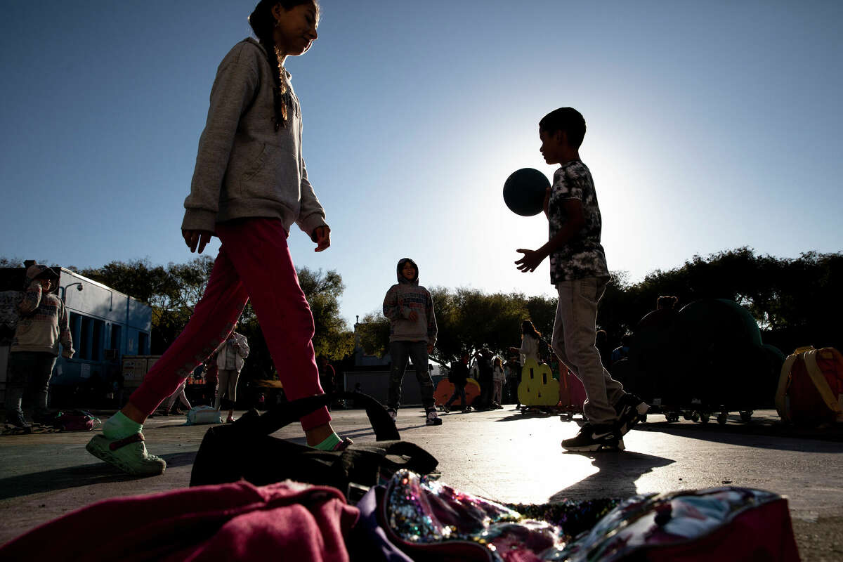Students play before class at Cesar Chavez Elementary School in San Francisco. Enrollment at most school districts in the state dropped during the pandemic.