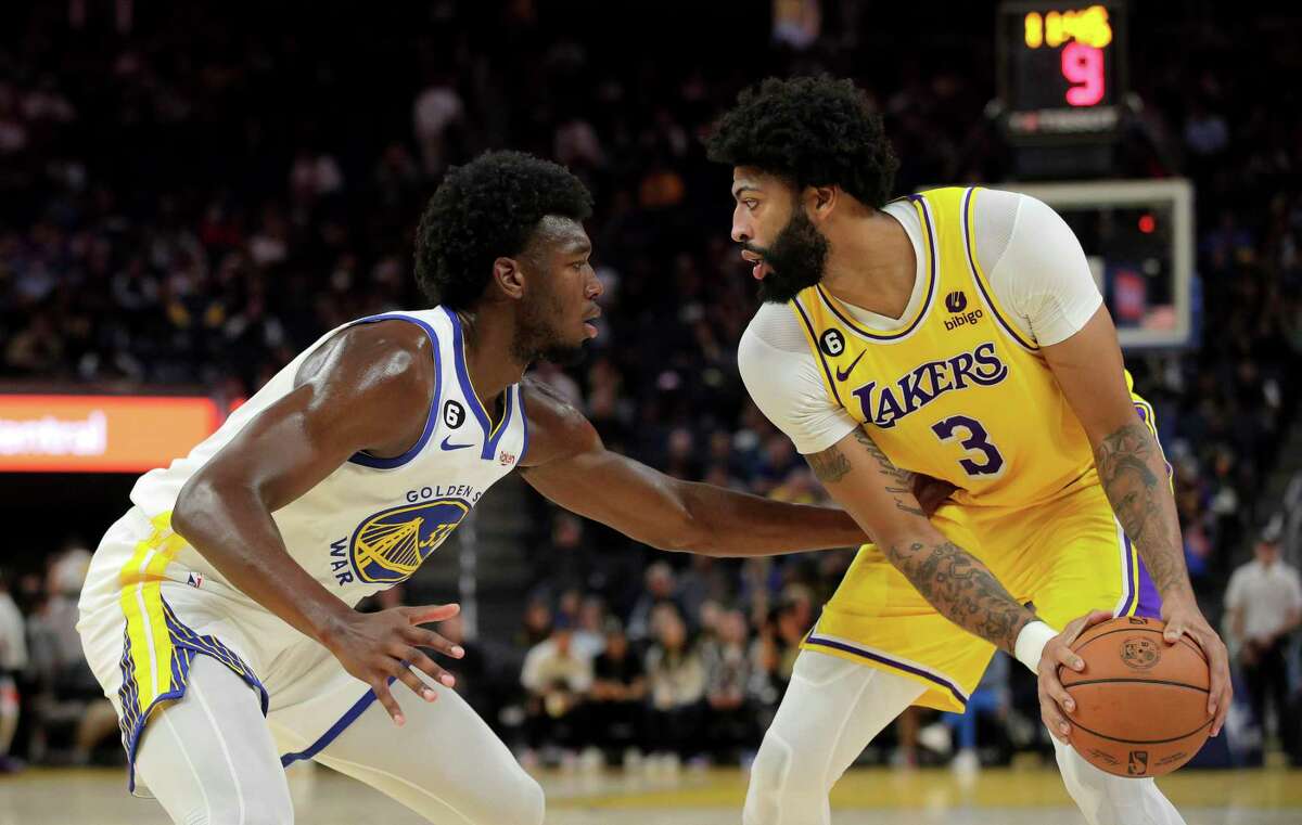 Golden State’s James Wiseman, left, defends against the Lakers’ Anthony Davis during the first half of Sunday’s game at Chase Center.