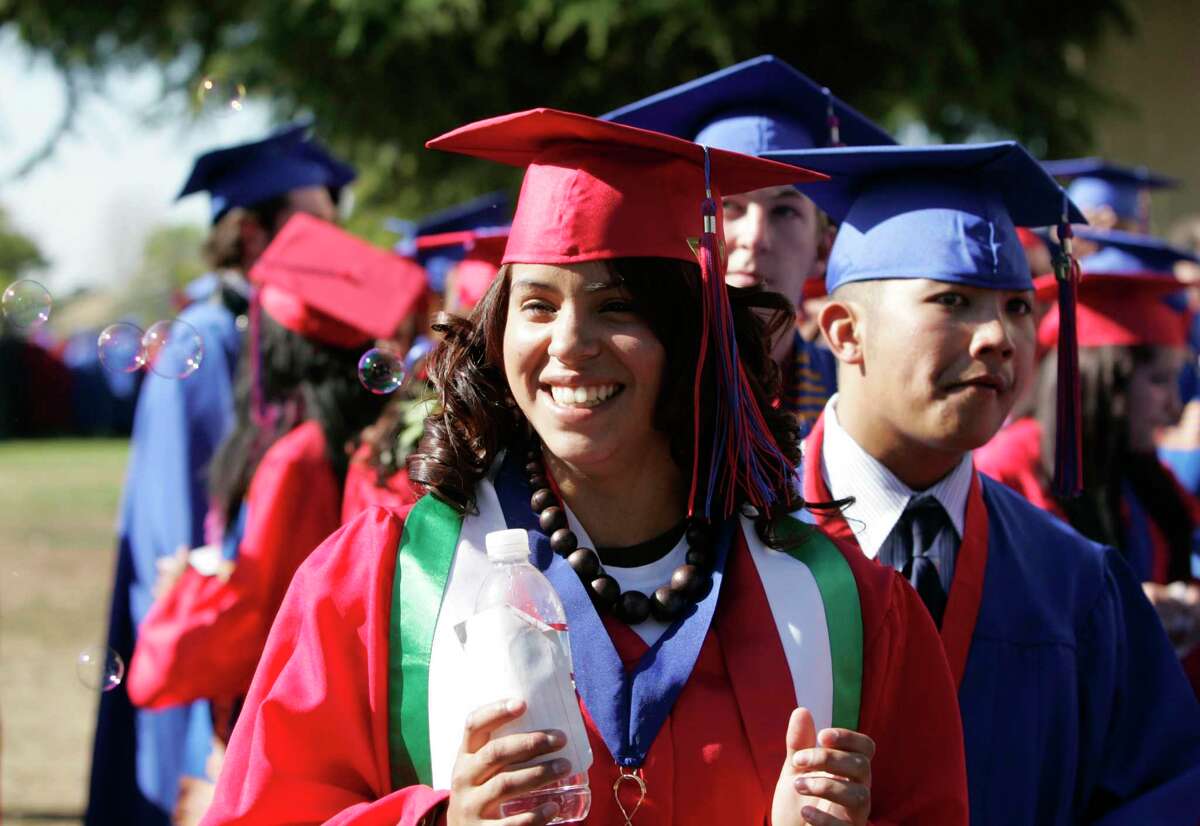 Veronica Santana at her 2007 San Leandro High School graduation ceremony at Cal State East Bay where she planned to attend college the following semester. California state universities are trying to lure more applicants for fall 2023. Deanne Fitzmaurice / The Chronicle