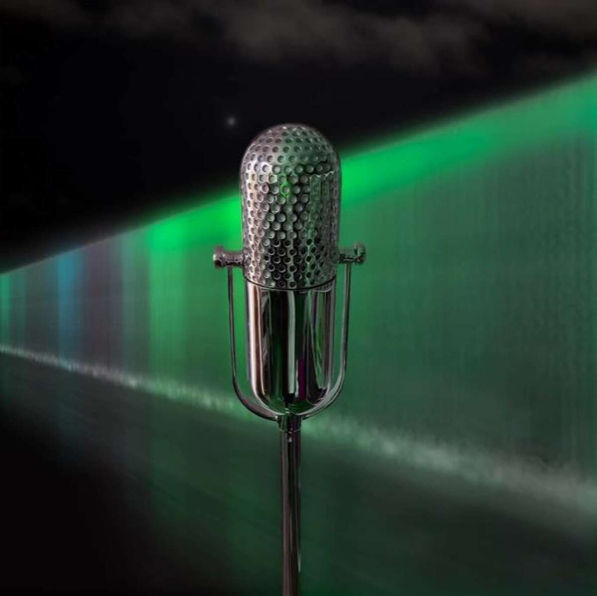 Adam Frank's public art piece "STREAM," shown in a rendering, includes a microphone tucked into a bronze sculpture of a microphone. Lights in the nearby water wall respond to sounds made into the microphone. The installation is part of the San Pedro Creek Culture Park.