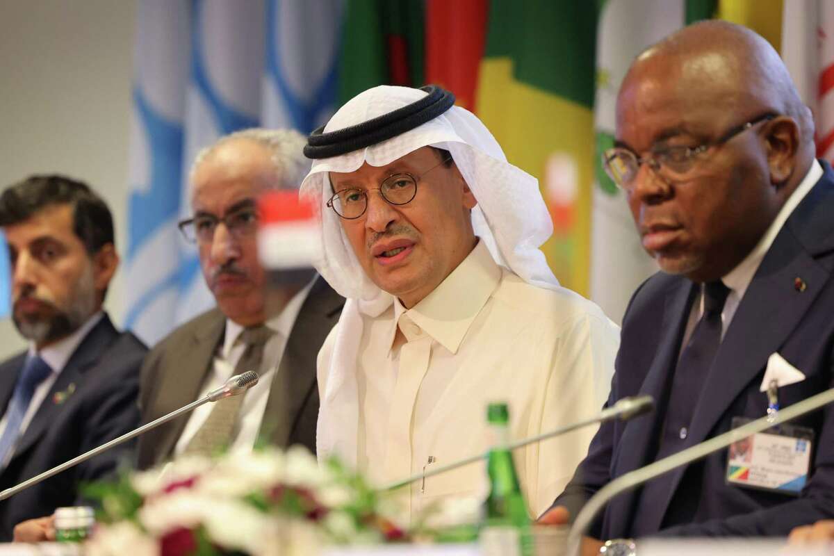 Abdulaziz bin Salman, Saudi Arabia’s energy minister, center, speaks during a news conference after OPEC+ agreed to cut its collective output limit by 2 million barrels a day to boost oil prices. Its action, along with increasing U.S. demand for gasoline, is leading to a rise in prices at the pump.
