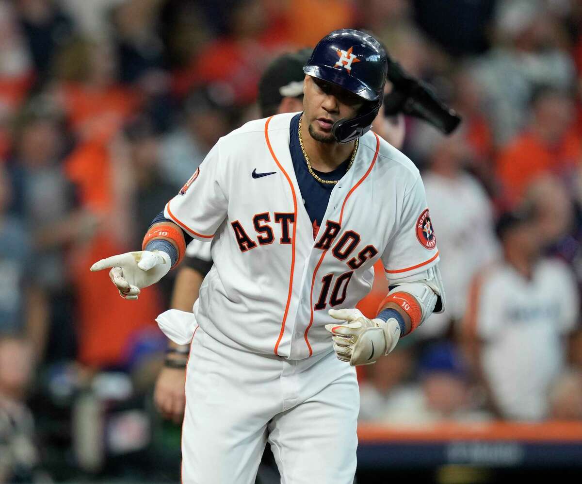 Houston Astros’ Yuli Gurriel (10) gestures toward the Astros’ dugout after hitting a solo home run off Seattle Mariners starting pitcher Logan Gilbert during the fourth inning of Game 1 of the American League Division Series at Minute Maid Park on Tuesday, Oct. 11, 2022, in Houston.
