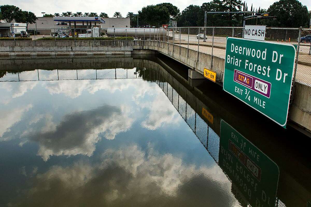 A fuel truck uses the service road in September 2017 as nearly 16 feet of floodwater from Hurricane Harvey fills Beltway 8, the Sam Houston Tollway, near Memorial Drive in Houston.