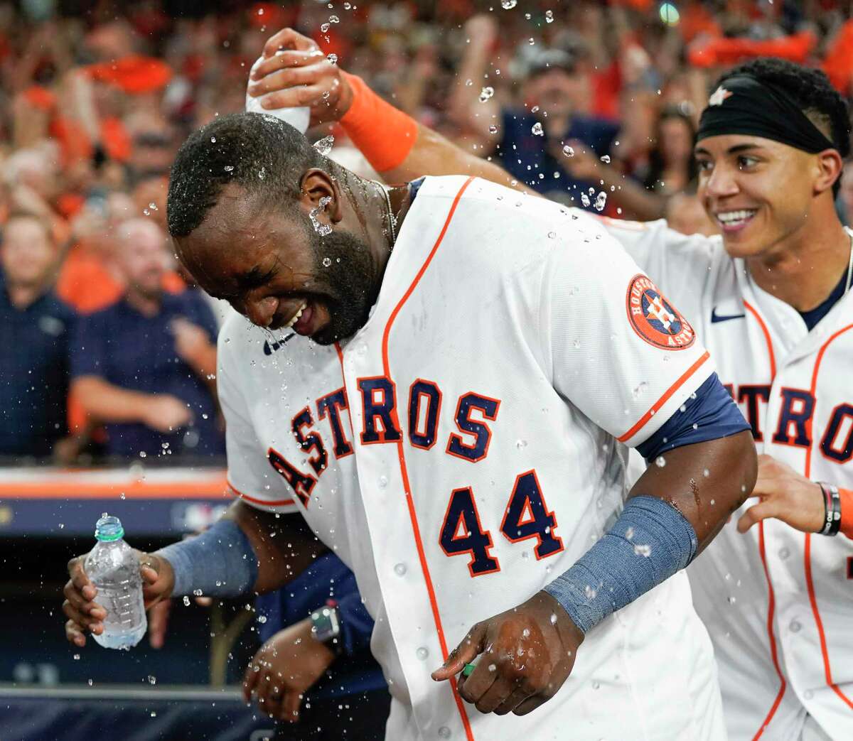 Houston Astros shortstop Jeremy Peña (3) dumps water on Yordan Alvarez (44) after his three-run, walk-off home run to beat the Seattle Mariners 8-7 in the ninth inning of Game 1 of the American League Division Series at Minute Maid Park on Tuesday, Oct. 11, 2022, in Houston.