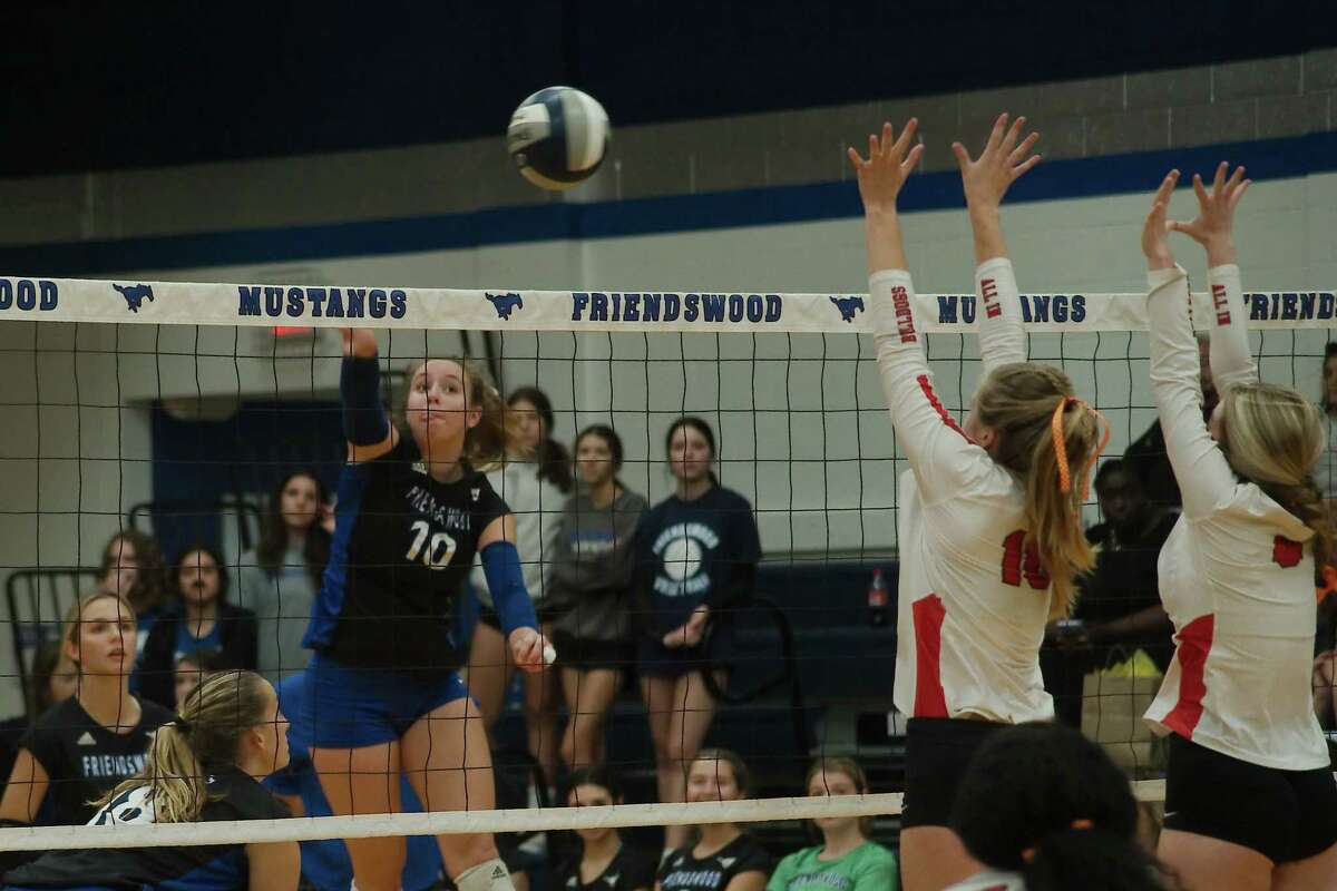 Friendswood’s Sydney Gibson (10) tries to hit a shot past Fort Bend Austin’s Ellie Pringle (16) and Fort Bend Austin’s Bailey Blackburn (8) Tuesday, Oct 11, 2022 at Friendswood High School.