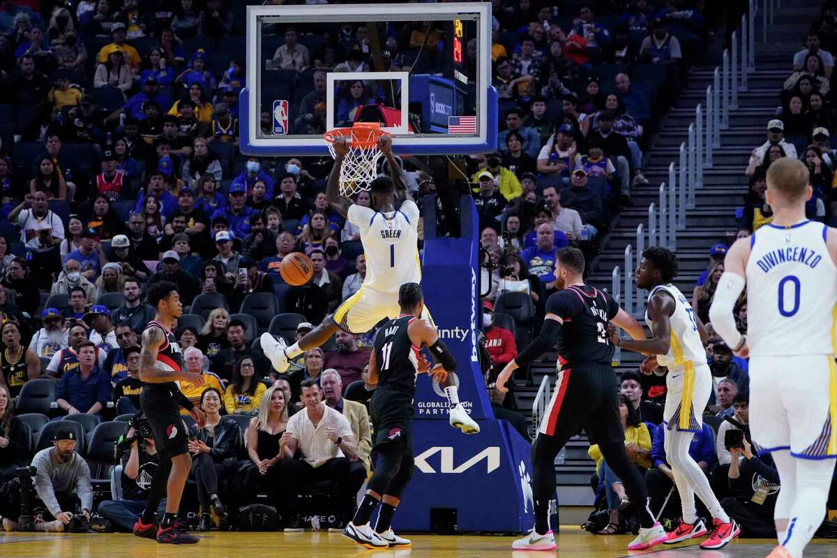 Golden State Warriors forward JaMychal Green (1) dunks against the Portland Trail Blazers during the first half of an NBA preseason basketball game in San Francisco, Tuesday, Oct. 11, 2022. (AP Photo/Godofredo A. Vásquez)