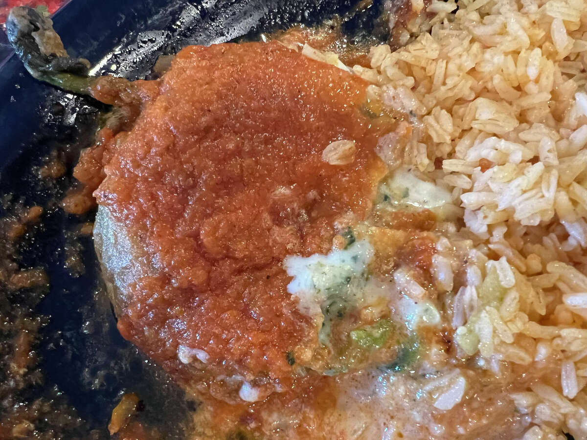 Casa Romero’s chile relleno filled with smooth creamy queso. Chile rellenos, a traditional Mexican dish, are stuffed peppers, which is what the name means in English. They are roasted, stuffed with cheese, then coated in a fluffy egg batter and fried until golden brown.