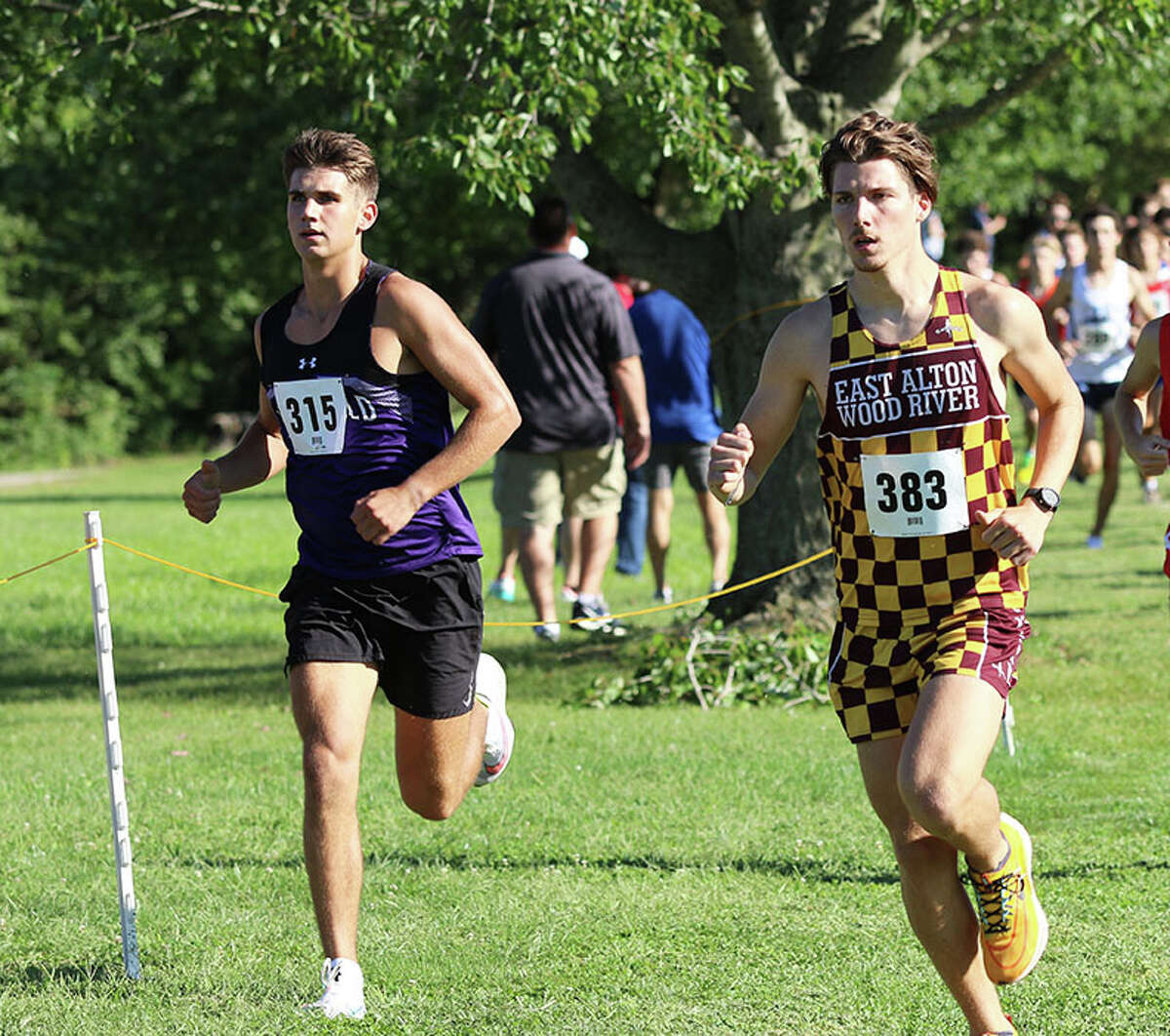 Litchfield's Camden Quarton (left) and EA-WR's Aidan Loeffelman run together in the opening mile of the Carlinville Early Meet on Aug. 30. On Saturday, Quarton won the juniors race and Loeffelman was second in the seniors race at the EA-WR Invite in Wood River.